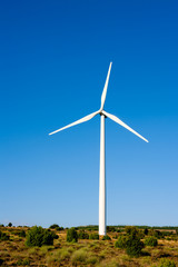 aerogenerator windmill in sunny blue sky