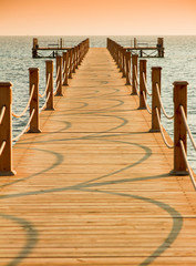 Pier over Sunset Waters © alma_sacra