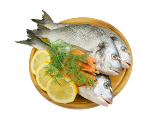 Dorado fish and shrimp on cutting board