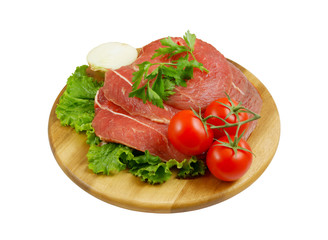 Raw beef meat with fresh vegetables on cutting board