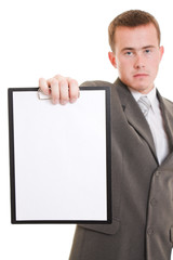 Businessman shows a blank page on a white background.
