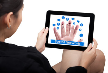 Business woman hold a touch pad showing social network icons