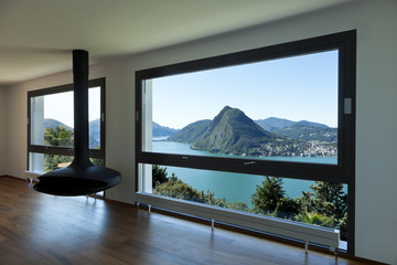 Fototapeta premium Modern apartment.large living room with panoramic window