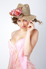 Young woman in straw hat.