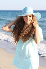 young happy woman on sea background