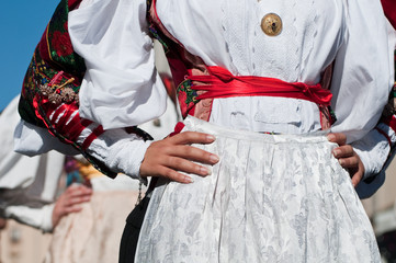 Sardinia, Italy: Redentore festival. Detail of a dress - obrazy, fototapety, plakaty