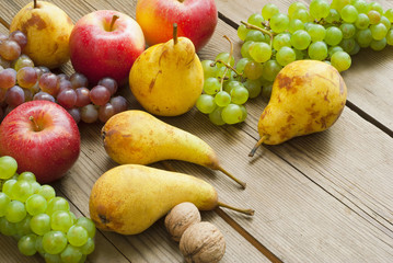apples grapes and pears, wooden table