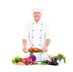 hef holding plate with fresh vegetables