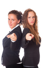 Two Business Women Pointing Their Fingers at Camera