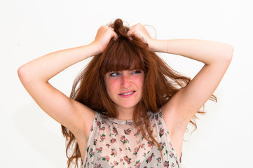 Young panic woman with hands on the head