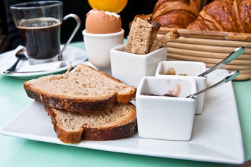 Breakfast with orange juice and fresh fruits on table