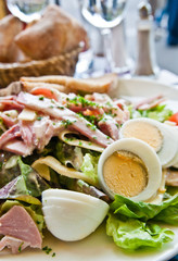 Fresh fruits salad and ham with egg