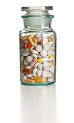 Full chemistry bottle with colorful pills