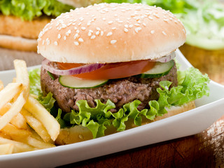 sandwich with hamburger and fried potatoes