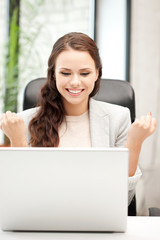 happy woman with laptop computer