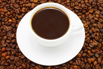 Cup of coffee on a coffee beans background
