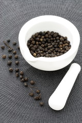 ceramic mortar and black pepper