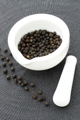 ceramic mortar and black pepper