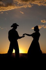 Cowboy couple silhouette almost touch