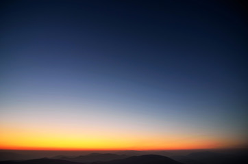Fototapeta na wymiar Colors of evening sky above the mountains