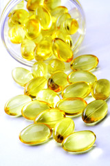 Cod liver oil pills on white