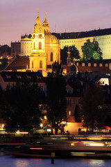Fototapeta na wymiar The night View on bright Prague St. Nicholas' Cathedral
