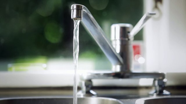 A glass is filled with water