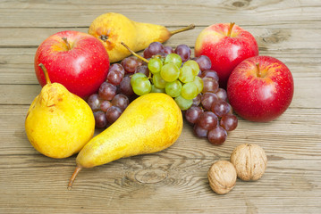 apples grapes and pears, wooden table