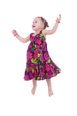 little girl jumps on a white background..