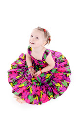 little girl in a bright dress isolated on a white background.
