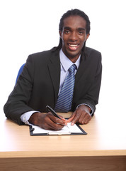 African American businessman signing document