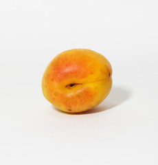 Fresh and ripe apricot isolated on a white background