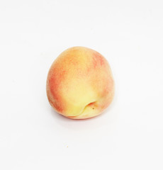 Full peach isolated on white background
