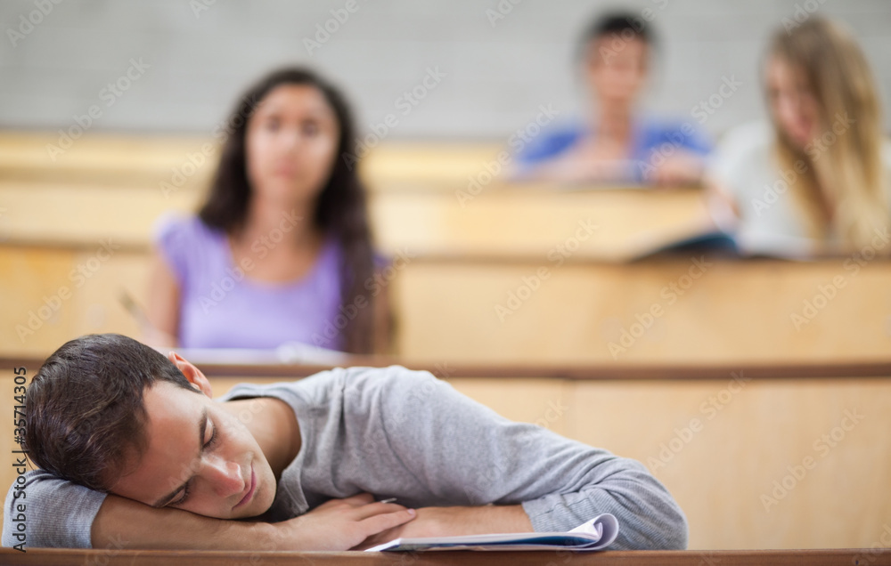 Poster student sleeping during a lecture