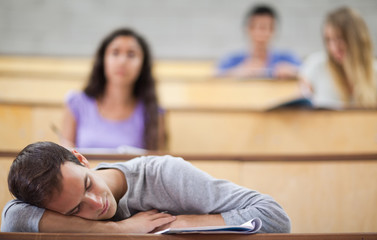 Fototapeta na wymiar Student sleeping during a lecture