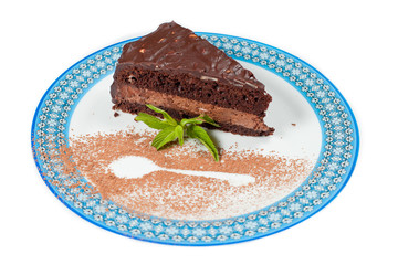 Piece of chocolate cake on white isolated background