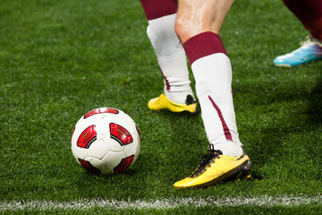 Naklejka premium Soccer players running after the ball