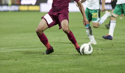 Obraz premium Soccer players running after the ball