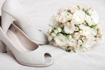 Wedding bouquet and bride's shoes