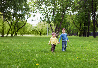 Fototapeta premium happy sister and brother outdoors