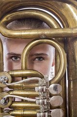 Close-up of girl staying behind a musical instrument