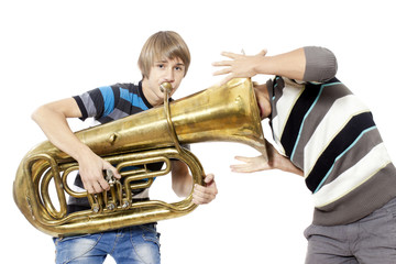 Fun boys enjoy with a trumpet