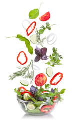 Falling vegetables for salad isolated on white