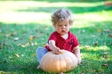 little girl with a pumpkin