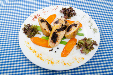 Meat and vegetable roll in plate