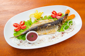 Fried fish in the plate