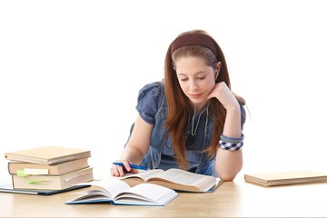 Young girl doing homework at desk