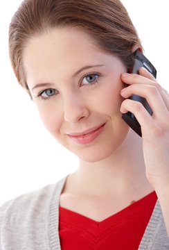 Portrait of young woman on mobile smiling