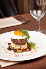 beef burger with egg and potatoes