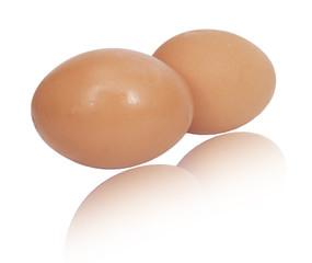 two brown eggs isolated on white background